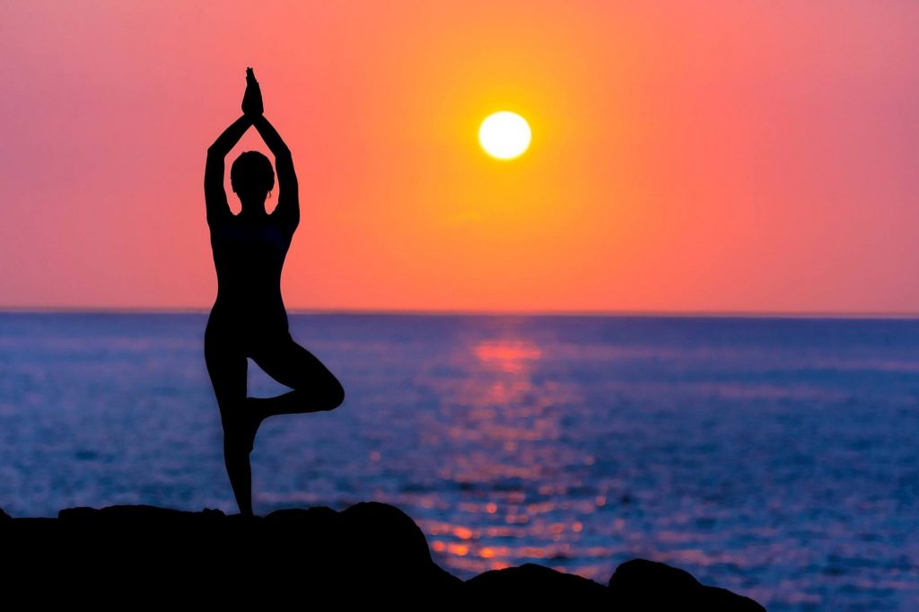 Yoga pose in sunset